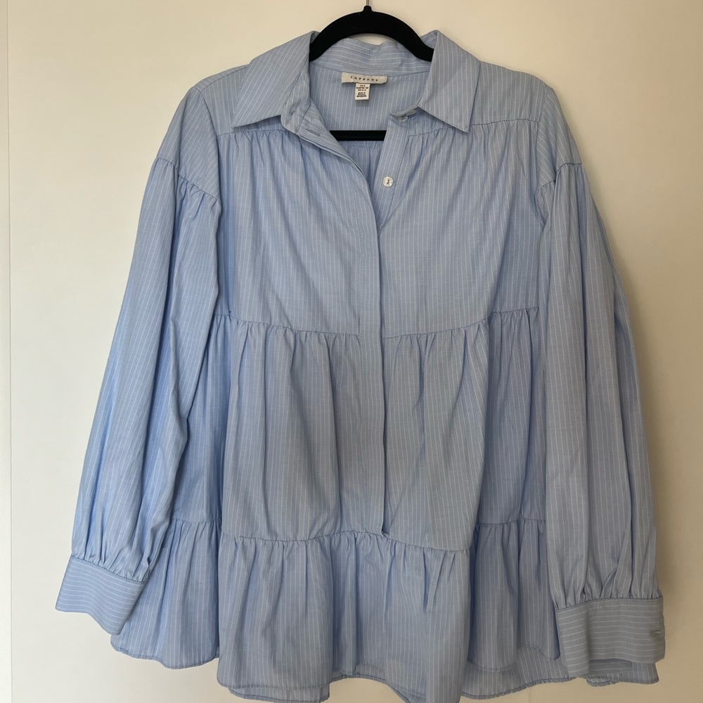Blue collared button-up shirt